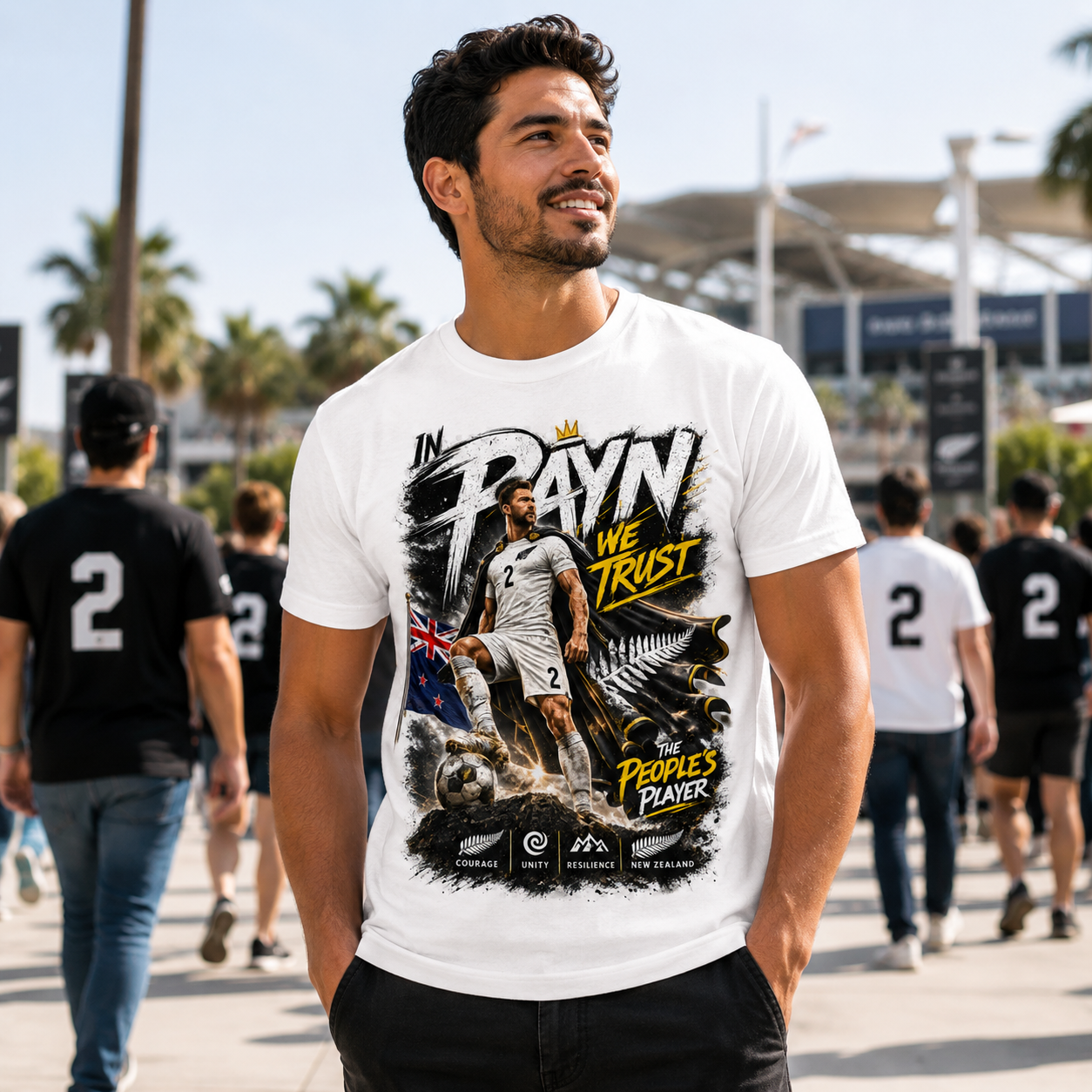 Male  football fan wearing white Tim Payne World Cup 2026 supporter tees outside a stadium